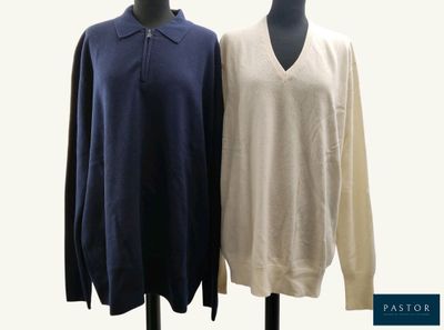 two men ' s sweaters on a mannequin stand with a white and blue shirt