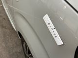 a sticker on the side of a car with a ruler attached to it