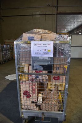 a cart with a lot of food in it in a warehouse