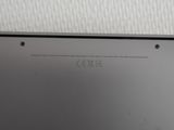 the back of a laptop computer with a small screen on top of it