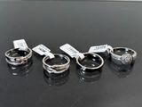 four different types of wedding rings with price tags on them