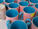 a lot of cups that are sitting on a table