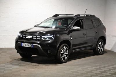 a picture of a black dacia parked in a garage