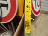 a close up of a street sign with a sticker on it