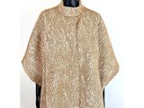 a close up of a mannequin mannequin wearing a gold sweater
