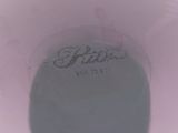 a close up of a white cup with writing on it