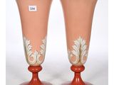 two vases that are sitting on a table