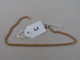 an image of a gold chain with a tag attached to it