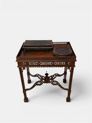 a small wooden table with a tray on top of it