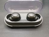 a pair of earphones sitting in a case on a table