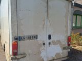 a white truck parked in front of a building