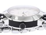 a close up of a watch with a chain around it