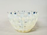 a glass bowl that is sitting on a table