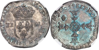 une pièce d'argent surmontée d'une couronne