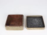 pair of antique tinned boxes on a white background
