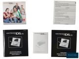 four nintendo ds manuals are shown on a white background