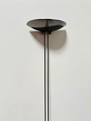 an image of a black floor lamp on a white wall