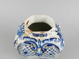 a blue and white vase with a blue and white design on it
