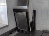 an image of a kitchen with a refrigerator and a window