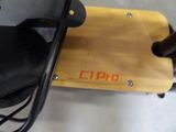 a close up of a skateboard with a wooden board attached to it