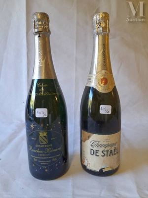two bottles of champagne sitting next to each other on a table