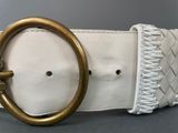 white leather belt with gold buckle and braid detail