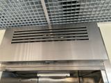 a stainless steel oven with a vent over it