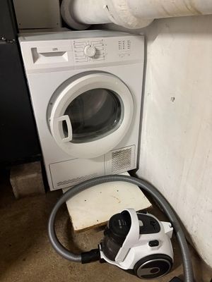 an image of a washing machine and a dryer in a room