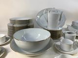 a lot of plates and cups on the table