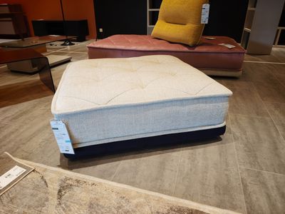 a mattress that is sitting on the floor in a room