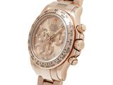 the rose gold rolex watch has a white dial and a diamond bezel