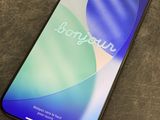 a close up of a phone on a table with a blurry background