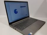 the laptop is sitting on the table with the screen open