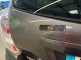a sticker on the back of a car with a sticker on it