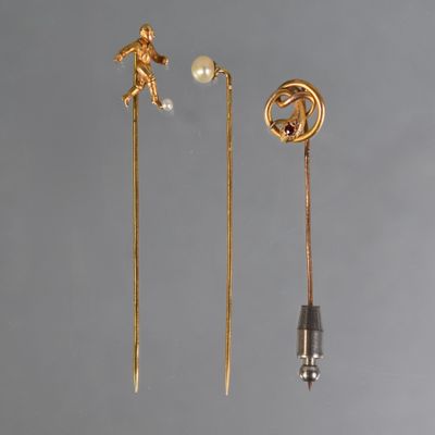 three pairs of gold plated earrings with pearls and a man on a horse
