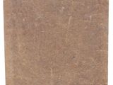an old brown piece of paper with a tag on it