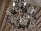 a chandelier hanging from the ceiling in a room
