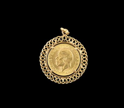 a close up of a gold coin on a black background