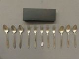 a lot of forks and spoons that are on the table