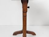 an image of a wooden table with three legs and a wooden top