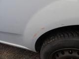 a close up of a car ' s front bumper with a denting on it