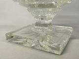 a clear glass bowl with a flower inside of it