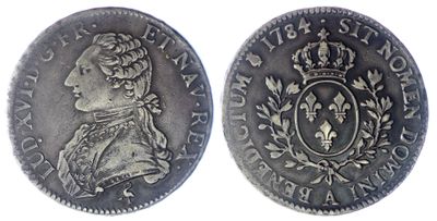 une pièce d'argent surmontée d'une couronne
