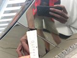 a person taking a picture of a reflection in a mirror