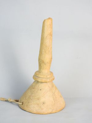 a small wooden lamp that is on a white surface