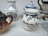 many different types of teapots sitting on a table