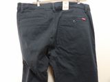a close up of a pair of black pants on a hanger