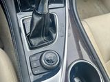 a close up of a car ' s interior with a gear lever
