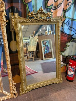 two mirrors that are sitting on the floor