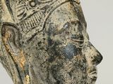 a close up of a statue of a woman with a crown on her head